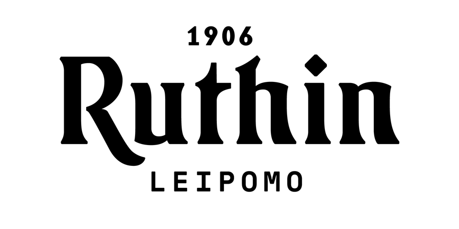 Ruthin leipomo logo musta la╠êpina╠êkyva╠êlla╠ê taustalla